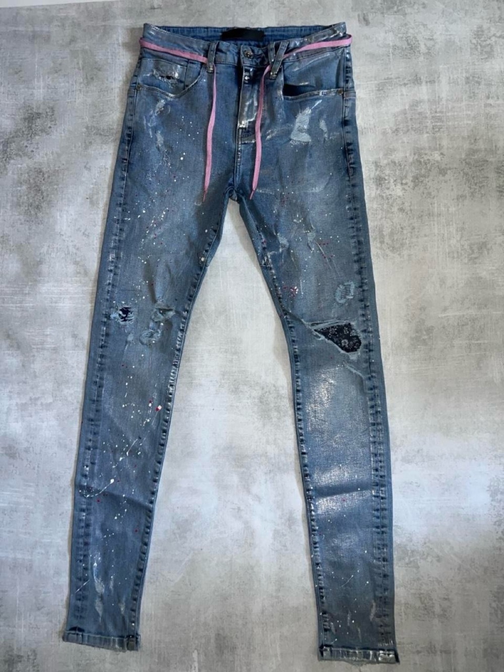 Kollar Denim 1/1 Pair distressed skinny jeans with a built-in drawstring belt.